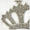 Large rhinestone encrusted crown appliqué with a heat-set adhesive applied to the back. Mesh background, large prong set rhinestones and silver beads complete this 8" wide x 6" tall stunner.
